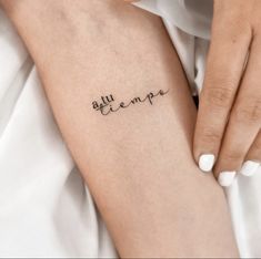 a woman's arm with a tattoo that reads, ella hempa