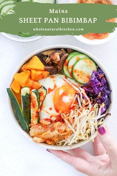 a bowl filled with meat and veggies on top of a white countertop