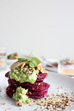 beet, avocado and walnut dessert on a white plate