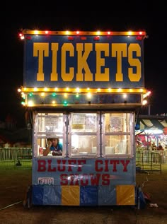 the ticket booth is lit up at night