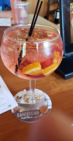 a close up of a drink in a glass on a table