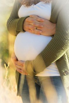 a woman holding a large white object in her hands