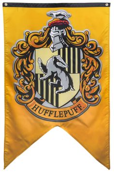 the hogwarts crest is shown in black and white with gold accents on it