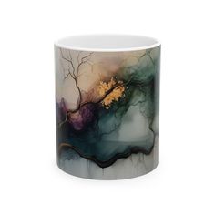 a white and black coffee mug with an abstract painting on the inside, in front of a white background