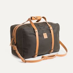 Canvas Duffle Bag Kann design x BDC | Bleu de chauffe Rectangular Outdoor Travel Bag With Top Carry Handle, Outdoor Rectangular Travel Bag With Top Carry Handle, Rectangular Weekender Bag With Leather Trim For Outdoor, Practical Bags With Adjustable Strap For Overnight Trips, Rectangular Travel Bag With Leather Trim For Outdoor, Brown Tote Duffle Bag For Outdoor, Olive Travel Bags With Leather Handles, Rectangular Khaki Duffle Bag For Travel, Olive Bags With Leather Handles For Travel