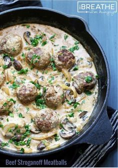 a skillet filled with meatballs and mushrooms