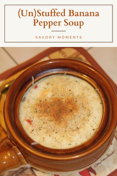 a brown bowl filled with soup on top of a table