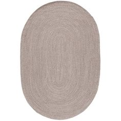 the oval rug is shown in beige