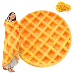 a woman holding a yellow waffle blanket next to a plate of corn on the cob