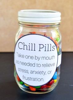 a jar filled with colorful candy sits on a table next to the words, perfect teacher gift for back to school