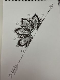 a drawing of an arrow with flowers on it