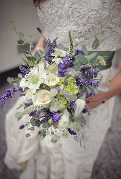 a bride holding a bouquet of flowers on her wedding day with the caption, purple bouquets images