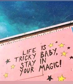 a pink sign with writing on it that says life is tricky baby, stay in your magic