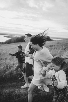 black and white photograph of children running in field