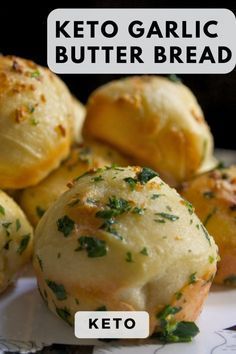 the keto garlic butter bread has been cut in half and placed on a plate