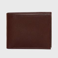 Bring convenience to carrying your money and cards with this Slimfold Wallet from Goodfellow & Co™. This bi-fold wallet features multiple card slots, ID pocket and a bill compartment, while the slimfold design lends it a non-bulky feel, making it easier to slip in the front or rear pockets of your trousers. Best of all, it features RFID blocking that helps prevent your cards and IDs from digital theft. Showcasing a faux-leather finish in brown, it's sure to bring classic style to your everyday a Brown Bifold Wallet With Rfid Blocking, Classic Bifold Wallet With Coin Pocket, Formal Brown Trifold Wallet With Rfid Blocking, Classic Brown Trifold Wallet With Coin Pocket, Brown Rfid Blocking Trifold Wallet For Formal Use, Brown Trifold Wallet With Id Window For Business, Business Brown Trifold Wallet With Id Window, Classic Trifold Wallet With Id Window, Classic Bifold Wallet With Card Slots