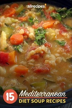 a bowl filled with soup and vegetables on top of a table