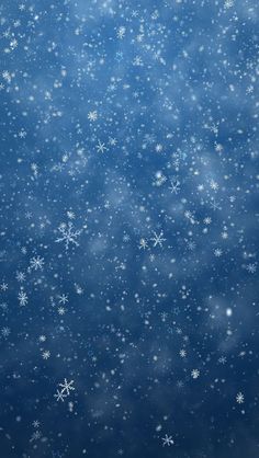 snow flakes are falling down on the blue background