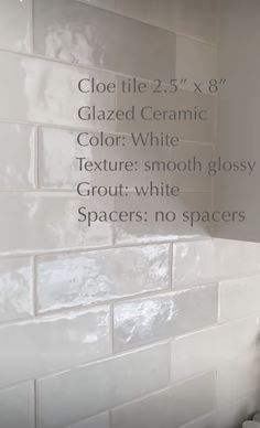 a white tiled wall with measurements for different types of tiles