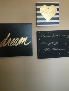 two black and gold signs hanging on the wall next to each other with words written on them