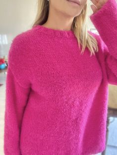 "MOHAIR HOT PINK SWEATER  This hot pink mohair sweater is soft and comfy! It is 100% hand knitted with mohair wool.  COMPOSITION * 100% hand knit * 90% mohair, 10% vegan angora blend * Super soft, not itchy  * Long sleeves * Drop shoulder * Plain design 💗The sweater is made in order and it can be knit according to your size.  It will be shipped in 7-10 days. SIZE The sweater's measurements in the photos are below.  The model is 170 cm/ 67\" and size M. -Chest: 24 inches (61 cm) -Sleeve: 21 inches (54 cm) -Length: 26 inches (65 cm) 🫧CARE * Turn your sweater inside out  * Use a mild, liquid detergent * Wash delicate wool set in cold water * Do not bleach * Dry flat //Pink Knit Sweater, Mohair Fuschia Sweater, Mohair Pullover, Handknit Oversized Jumper, Handknit Christmas Gift, Pink Knit Ov Winter Oversized Crew Neck Knitting Pattern, Oversized Winter Crew Neck Knitting Pattern, Oversized Crew Neck Knitting Pattern For Winter, Oversized Mohair Sweater With Soft Texture, Cozy Crew Neck Soft Knit Pattern, Cozy Crew Neck Knitting Pattern In Soft Knit, Cozy Mohair Crew Neck Sweater, Cozy Pink Mohair Sweater, Soft Knit Mohair Crew Neck Sweater