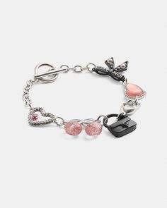 COACH® | Bow And Heart Charm Bracelet Trendy Multicolor Jewelry With Removable Charms, Trendy Metal Charm Bracelet For Parties, Enamel Bracelet Jewelry With Lobster Clasp, Enamel Bracelet With Lobster Clasp, Trendy Silver Enamel Jewelry, Pink Enamel Jewelry For Party, Pink Enamel Party Jewelry, Metal Charm Bracelet With Heart Charm For Party, Party Charm Bracelet With Dangle