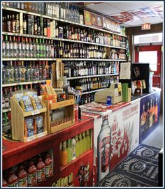 a store filled with lots of different types of drinks and condiments on shelves