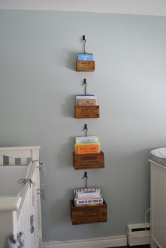 a baby's room with books on the wall