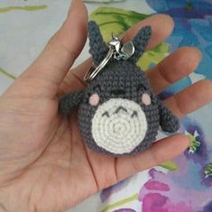 a small crocheted keychain with a monkey on it's face