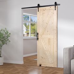 an open wooden door in a white room