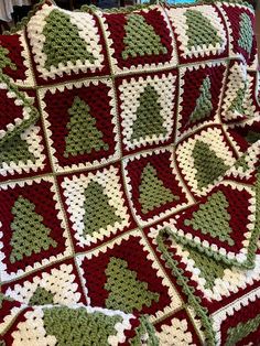 a crocheted blanket that is on top of a couch