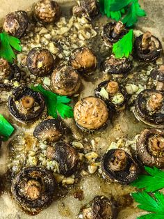 mushrooms and parsley on a baking sheet