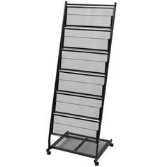 a black metal rack with five drawers on it's sides and one drawer open