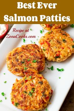 three crab cakes on a white plate with the words best ever salmon patties