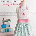 a child's apron sewing pattern on a mannequin