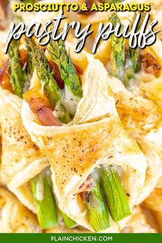 a plate with asparagus, bacon and parmesan wraps on top of it