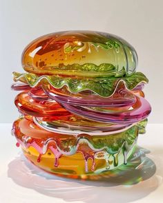 a stack of colorful glass dishes sitting on top of each other