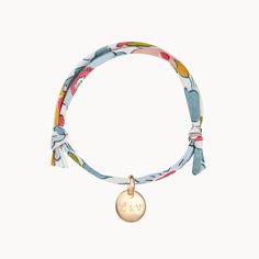 Add a delicate touch of colour to your jewellery collection with the feminine and floral prints of our Personalized Mini Charm Liberty Bracelet. Choose between a mini heart, mini disc or mini star charm to hand-engrave with a special initial to sit alongside your favourite Liberty print as a gift for you or someone close to cherish.18K Champagne Gold Plated, 925 Sterling Silver or 18K Rose Gold PlatedCharms sizes: 0.4 x 0.4 (Mini Heart, Disc or Star)Fully adjustable sliding knot fasteningHand-en Bead Jewlrey, Liberty Bracelet, Heart Disc, Mini Charm, Liberty Print, Sliding Knot, Mini Heart, Champagne Gold, Star Charms