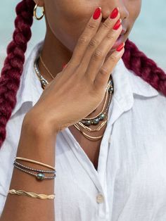 "Flaunting a colorful pearlescent finish, the peacock pearls strung along this adjustable beaded bracelet have been emphasized with gold-filled accents for a sizzling tropical twist. ✦ DETAILS ✦ ✧ Name: Maile (MIE-leh) - vine. ✧ Adjustable Length from: 6\"-7.5\" Inches. ✧ Black/Peacock 2-3mm Freshwater Pearls. ✧ 14kt Gold Filled Components, Extender, and Clasp. ✧ All Ke Aloha Jewelry pieces come packaged thoughtfully, beautifully, and ready for gift giving. ✦ MORE GOLD BRACELETS ➤ https://www.et Elegant Multicolor Stackable Jewelry, Elegant Multicolor Stackable Beaded Bracelets, Gold Multi-strand Hand-strung Jewelry, Hand-strung Multi-strand Gold Jewelry, Elegant Multicolor Stackable Bracelets, Multicolor Adjustable Gold Bracelet, Elegant Hand-strung Multi-strand Jewelry, Elegant Adjustable Multicolor Gold Bracelet, Gold Fusion Bracelets With Round Beads