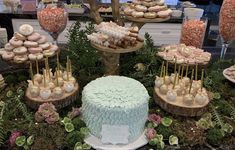 a table filled with lots of different types of desserts