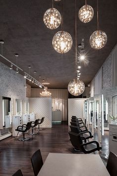 an image of a salon with chandeliers hanging from the ceiling