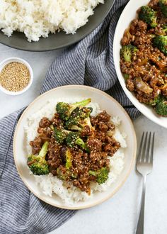 two plates with rice, broccoli and ground beef on them next to silverware