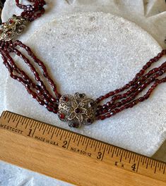 Circa 1800s Victorian Facated Garnet Sterling Silver Filigree Antique Bib Festoon Necklace Measures 16 inches around Antique Necklace With Historical Design For Formal Occasions, Antique Necklace With Historical Design For Formal Events, Victorian Necklace With Historical Design For Formal Occasions, Victorian Historical Design Necklaces For Formal Occasions, Victorian Historical Design Necklace For Formal Occasions, Victorian Historical Design Formal Necklace, Antique Beaded Jewelry For Formal Occasions, Victorian Round Necklace With Intricate Design, Victorian Necklace With Intricate Design