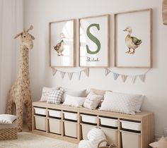 a room with some pictures hanging on the wall and stuffed animals in baskets next to it