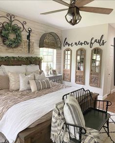 a large bed sitting in a bedroom on top of a hard wood floor