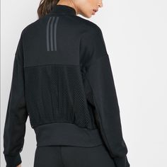 Perfect Lightweight Front Zip Adidas Bomber Jacket. Mesh Paneling In Back And Under Arms. Comfortable Poly-Cotton Blend Fabric. Dual Side Slip-In Pockets. Adidas Long Sleeve Track Jacket Athleisure, Adidas Long Sleeve Track Jacket In Athleisure Style, Adidas Long Sleeve Athleisure Track Jacket, Adidas Long Sleeve Track Jacket For Athleisure, Adidas Fall Track Jacket With Ribbed Cuffs, Adidas Track Jacket With Ribbed Cuffs For Fall, Black Track Jacket For Fall, Black Stretch Track Jacket For Fall, Black Track Jacket For Workwear In Fall