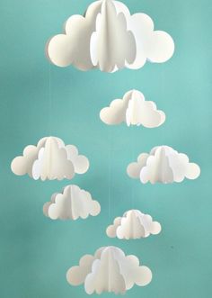 paper clouds are floating in the air on a blue background with text that reads mobile d'ivvens 3d