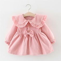 Cute Long Sleeve Birthday Dress, Cute Long Sleeve Dresses For First Birthday, Cute Doll Collar Winter Dress, Long Sleeve Ruffled Dresses For First Birthday, Cute Winter Dress With Doll Collar, Pink Long Sleeve Dress For First Birthday, Winter Cotton Dresses With Ruffles, Pink Dress For Dress-up Occasions In Fall, Pink Long Sleeve Dress For Playdate