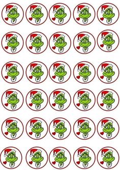 the grin face stickers are in red and green circles with santa's hats on them