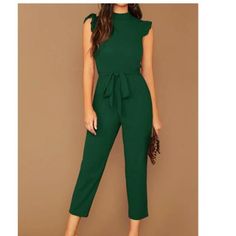 Shein Unity Mock-Neck Ruffle Cuff Self Belted Jumpsuit Size Small - Accidently Ordered The Xs And Small And Like How The Xs Fits On Me Better Color: Dark Green Style: Elegant Pattern Type: Plain Type: Other Neckline: Stand Collar Details: Ruffle, Belted, Zipper Length: Capris Fit Type: Regular Fit Sleeve Length: Sleeveless Waist Line: High Waist Fabric: Non-Stretch Material: Fabric Composition: 95% Polyester, 5% Elastane Care Instructions: Machine Wash Or Professional Dry Clean Body: Unlined Bel Casual Ruffled Jumpsuits And Rompers For Work, Collar Details, Shein Pants, Belted Jumpsuit, Belt Jumpsuit, Clean Body, Elegant Pattern, Green Style, Neck Ruffle